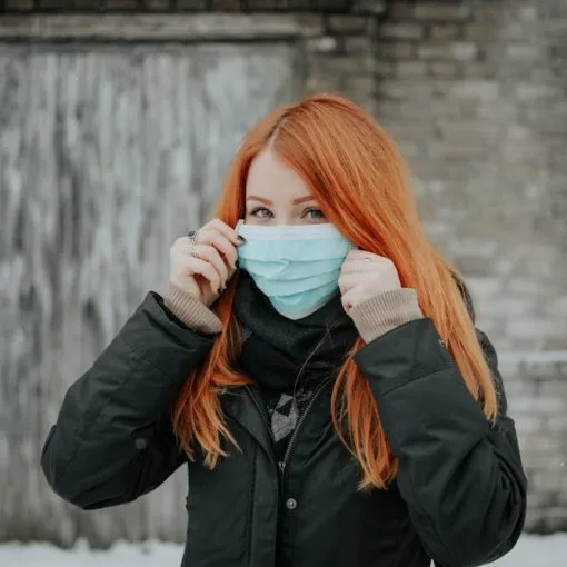 covid19 redheaded girl wearing a mask