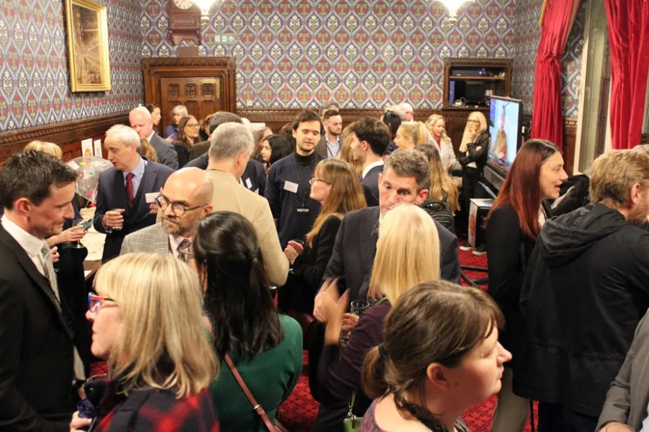 people in a room chatting during the Esme’s Umbrella event at The House of Commons